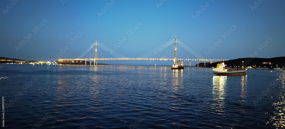Fototapeta premium sunset over the sea bridge