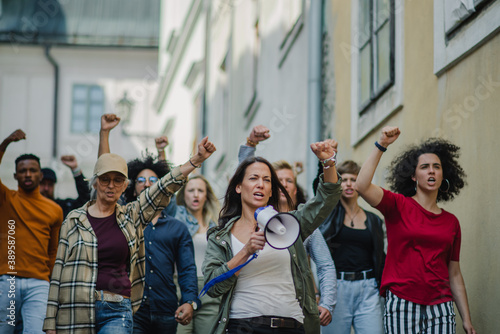 Group of people activists protesting on streets, strike, demonstration and coronavirus concept. photo