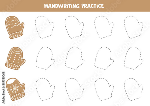 Tracing contours of Christmas gingerbread cookies in shape of mittens.