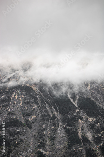 swiss mountains in the clouds  foggy weather in Switzerland