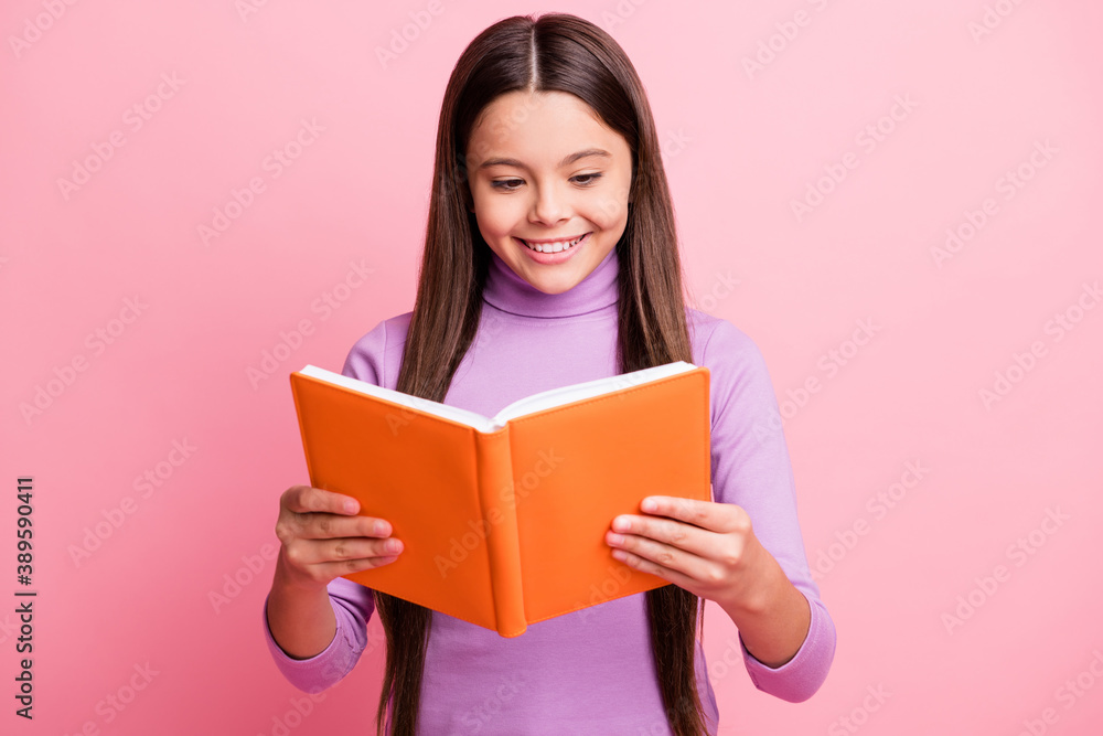 Portrait of her she nice attractive pretty lovely educated cheerful cheery focused long-haired girl reading dictionary paper book isolated over pink pastel color background Portrait of her she nice attractive pretty lovely educated cheerful cheery focused long-haired girl reading dictionary paper book isolated over pink pastel color background