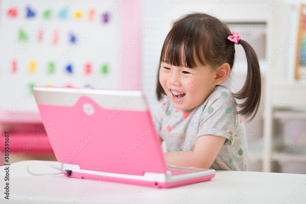 young girl using laptop for online learning during lockdown time young girl using laptop for online learning during lockdown time