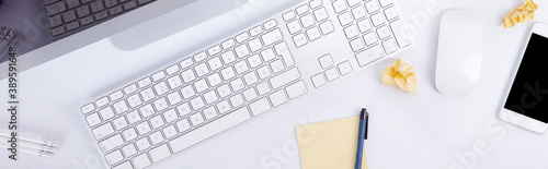 new modern keyboard with screen and computer mouse with smartphone and clumps of paper isolated on white background, close view . High quality photo