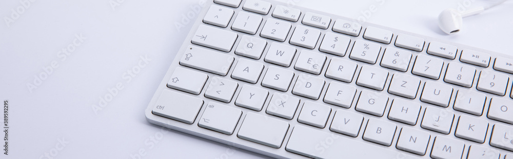new modern keyboard with snew modern keyboard with smartphone and earphones isolated on white background, close view martphone and earphones isolated on white background, close view . High quality new modern keyboard with snew modern keyboard with smartphone and earphones isolated on white background, close view martphone and earphones isolated on white background, close view . High quality