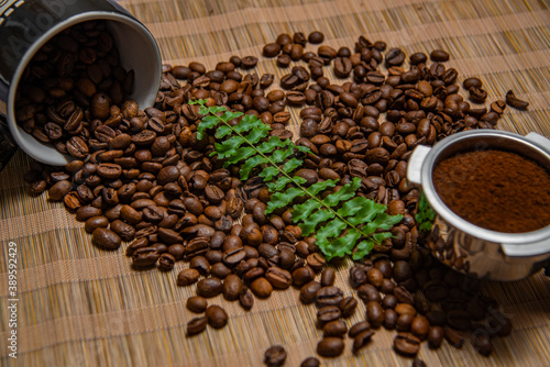 roasted coffee beans and a cup of coffee