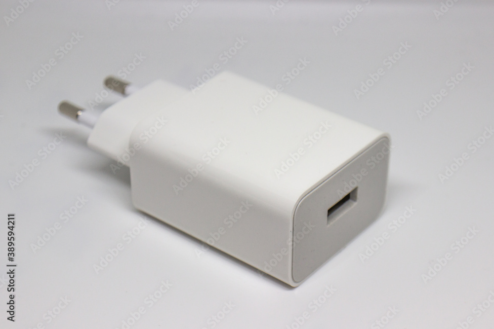 White mobile phone chargers on a white background White mobile phone chargers on a white background