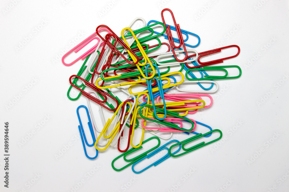 colorful paperclips on a white background colorful paperclips on a white background