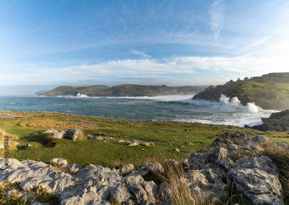 huge waves crashing onto the shores of Cabo de Ajo on the northern Spanish coast huge waves crashing onto the shores of Cabo de Ajo on the northern Spanish coast