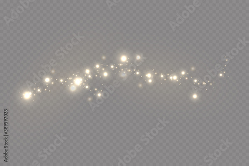 Christmas light effect. Sparkling magical dust particles.The dust sparks and golden stars shine with special light. photo