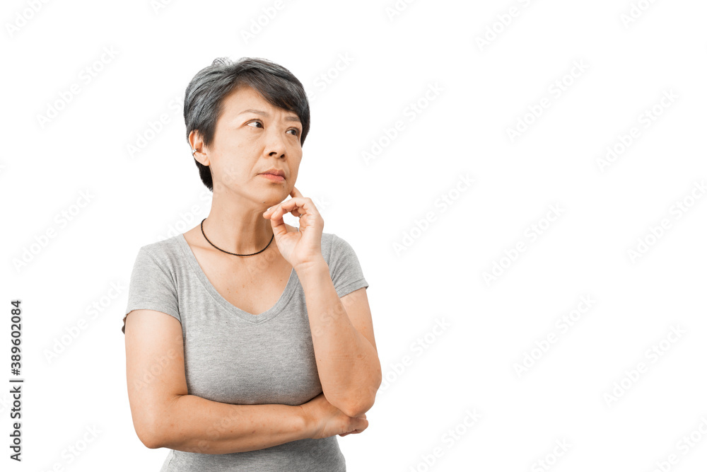 A middle-aged gray-haired Asian woman is wondering, confused, touching her face with her fingers, thinking about an idea, or worried about something. Concept of a mid-life crisis A middle-aged gray-haired Asian woman is wondering, confused, touching her face with her fingers, thinking about an idea, or worried about something. Concept of a mid-life crisis