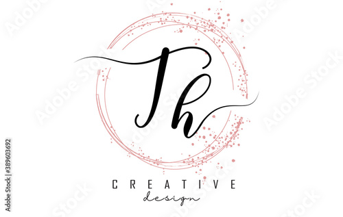 Handwritten TH T H letter logo with sparkling circles with pink glitter.