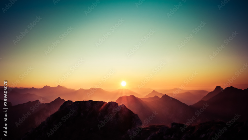 Beautiful Sunset or Sunrise above Mountains with clear sky. Alps, Allgau, Bavaria, Germany.