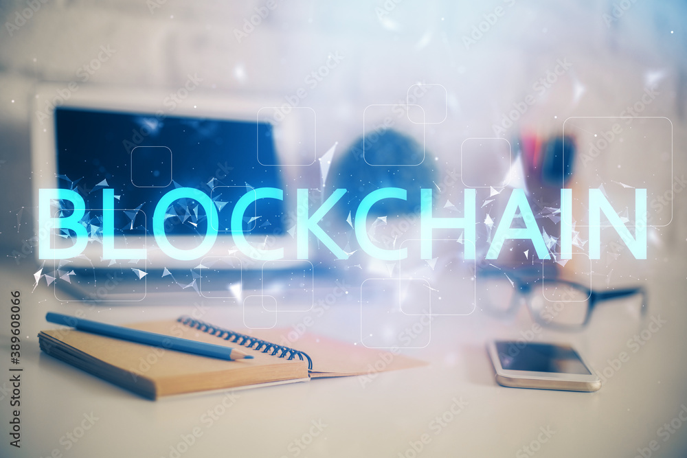 Double exposure of blockchain theme hologram and table with computer background. Concept of bitcoin crypto currency. Double exposure of blockchain theme hologram and table with computer background. Concept of bitcoin crypto currency.