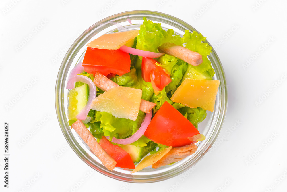 Healthy food - mix vegetable salad served in a bowl over white background. Healthy eating, delicious snack or dinner. Healthy food - mix vegetable salad served in a bowl over white background. Healthy eating, delicious snack or dinner.
