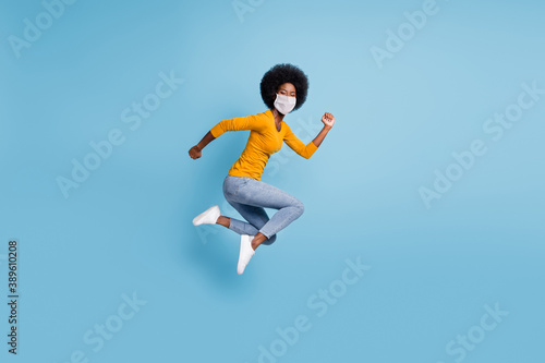 Photo portrait full size of woman running jumping up use medical respirator isolated on pastel blue colored background