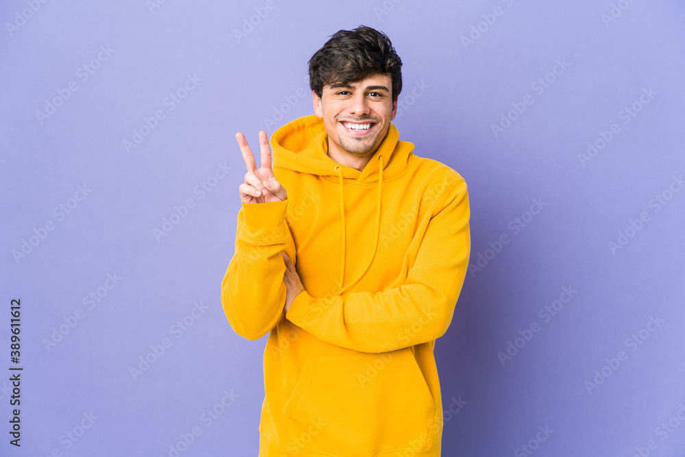 Young cool man showing number two with fingers. Young cool man showing number two with fingers.