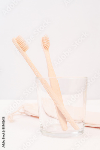 Close-up of Bamboo Toothbrushes in White Mug on Blurred Background Oral Hygiene Dental Concept 