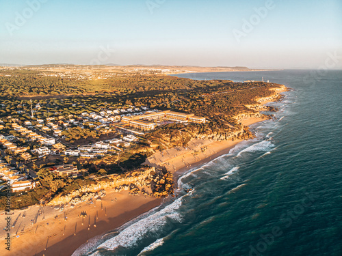 Calas de Roche in Conil in Cadiz Spain from above shot with a drone at sunset © Pav