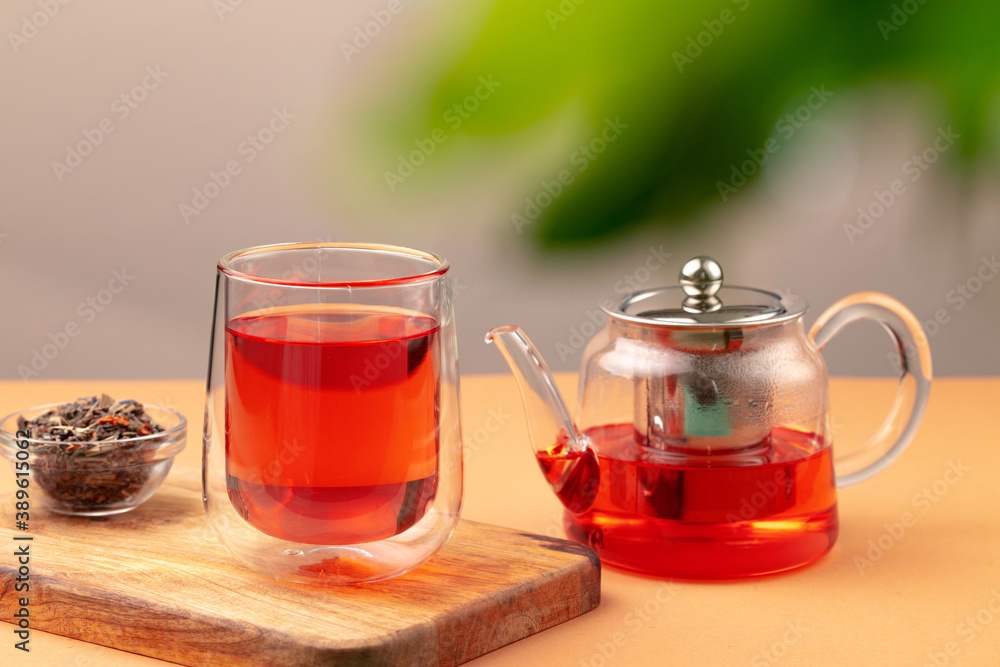 Glass teapot and cup with black tea Glass teapot and cup with black tea