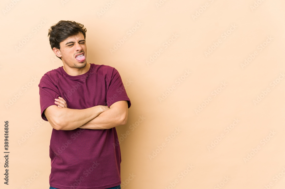 Young cool man funny and friendly sticking out tongue. Young cool man funny and friendly sticking out tongue.