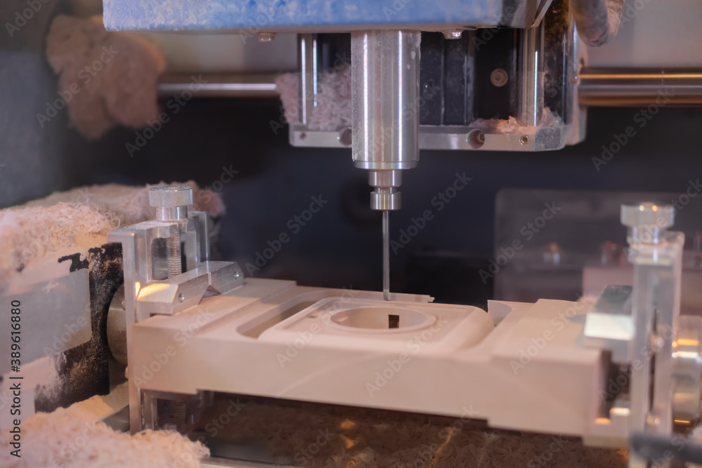 Automated cnc milling machine cutting wooden workpiece from wood pulp, making 3d model at technology exhibition, factory - close up. Woodworking, engraving, carving, industrial, manufacturing concept Automated cnc milling machine cutting wooden workpiece from wood pulp, making 3d model at technology exhibition, factory - close up. Woodworking, engraving, carving, industrial, manufacturing concept