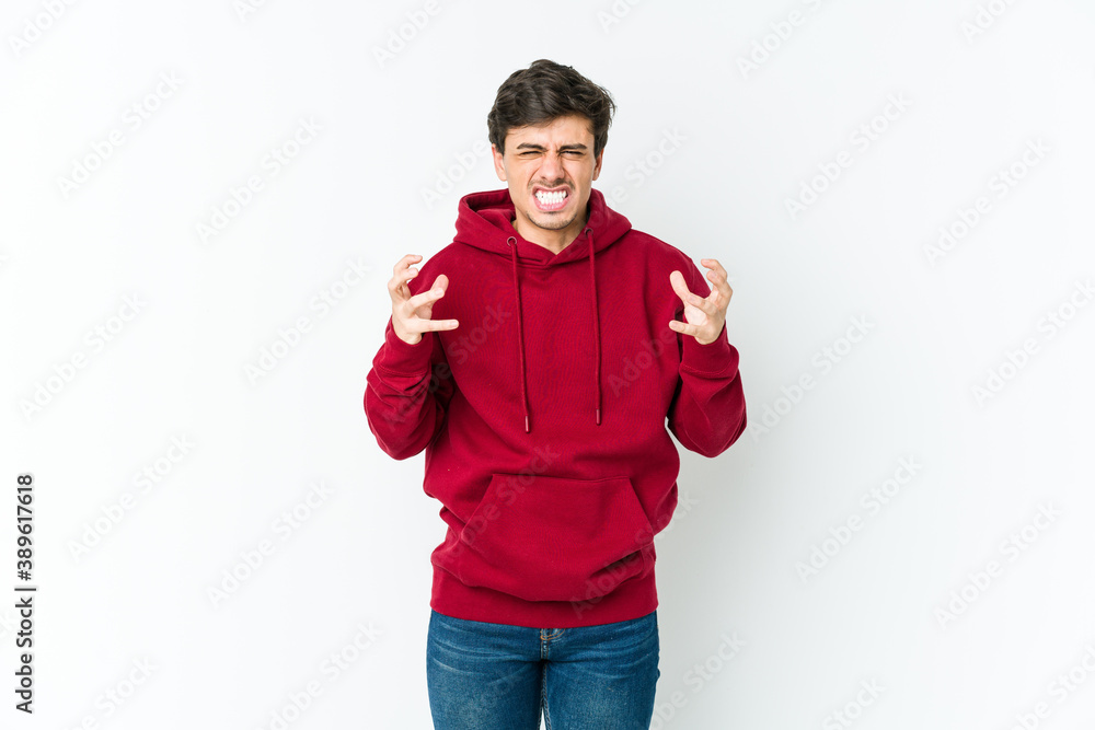 Young cool man upset screaming with tense hands. Young cool man upset screaming with tense hands.