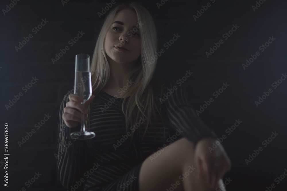 sexy blonde girl drinks champagne from a glass, evening glamorous style portrait sexy blonde girl drinks champagne from a glass, evening glamorous style portrait