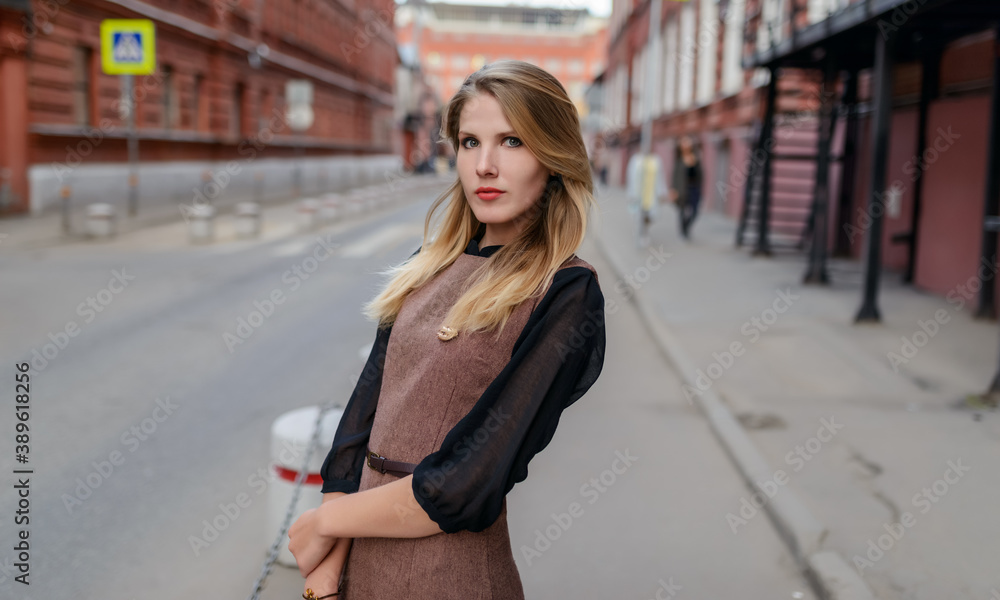 Outdoors portrait of beautiful young woman. Selective focus. Outdoors portrait of beautiful young woman. Selective focus.