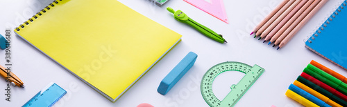 collection of bright colorful stationery on light background, close view . High quality photo
