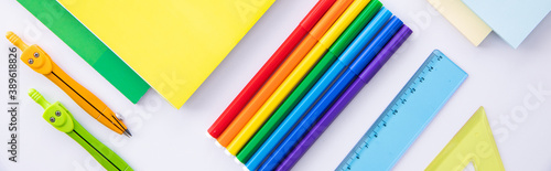 collection of bright colorful stationery on light background, close view . High quality photo