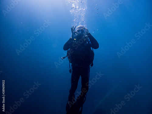 Scuba diver in blue ocean
