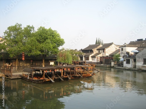 boats at river side with Chinese building