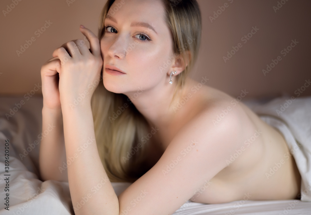 Close up portrait of a beautiful young lady lying on the bed. Close up portrait of a beautiful young lady lying on the bed.
