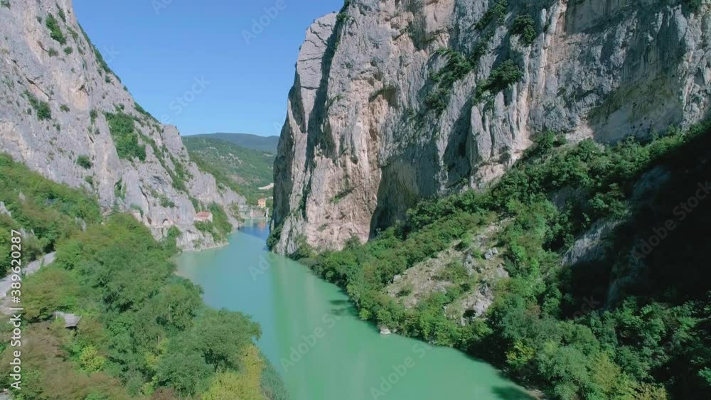 Drone view of the furlo pass, the fascinating canyon of the marche region (Italy). Between the massive walls of the mountains Pietralata and Paganuccio, and and the water of the river Candigliano Drone view of the furlo pass, the fascinating canyon of the marche region (Italy). Between the massive walls of the mountains Pietralata and Paganuccio, and and the water of the river Candigliano