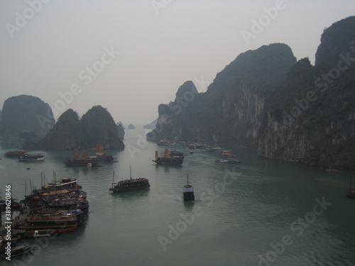 Sailing among the stunning limestone cliffs and mountain islands of Ha Long Bay in Vietnam
