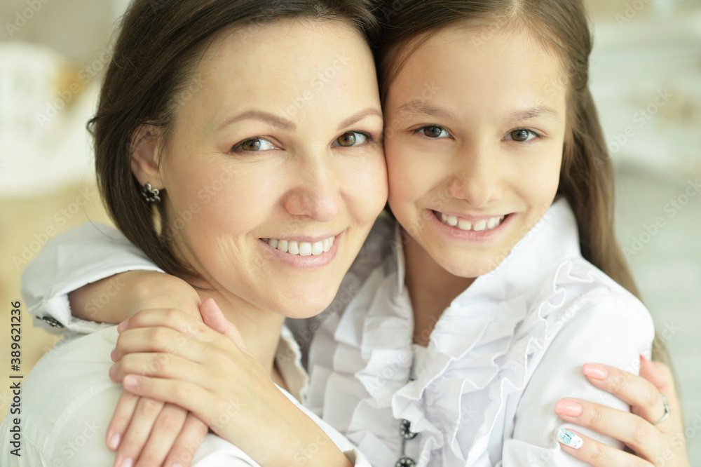 Beautiful young mother and cute little daughter posing Beautiful young mother and cute little daughter posing