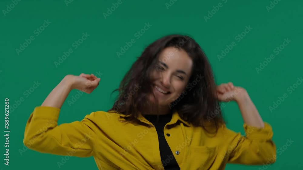 woman 20s wearing casual screaming and clenching fist like rejoicing victory or triumph on Green Screen, Chroma Key woman 20s wearing casual screaming and clenching fist like rejoicing victory or triumph on Green Screen, Chroma Key