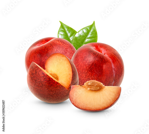 Fresh red plum fruits with leaves and slice isolated on white background