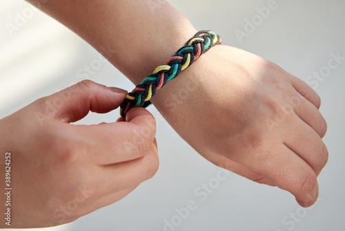 Wallpaper Mural Bracelet made of fabric ropes on a woman's hand. Torontodigital.ca