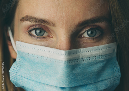 Closeup portrait of a woman wearing mask. Quarantine concept