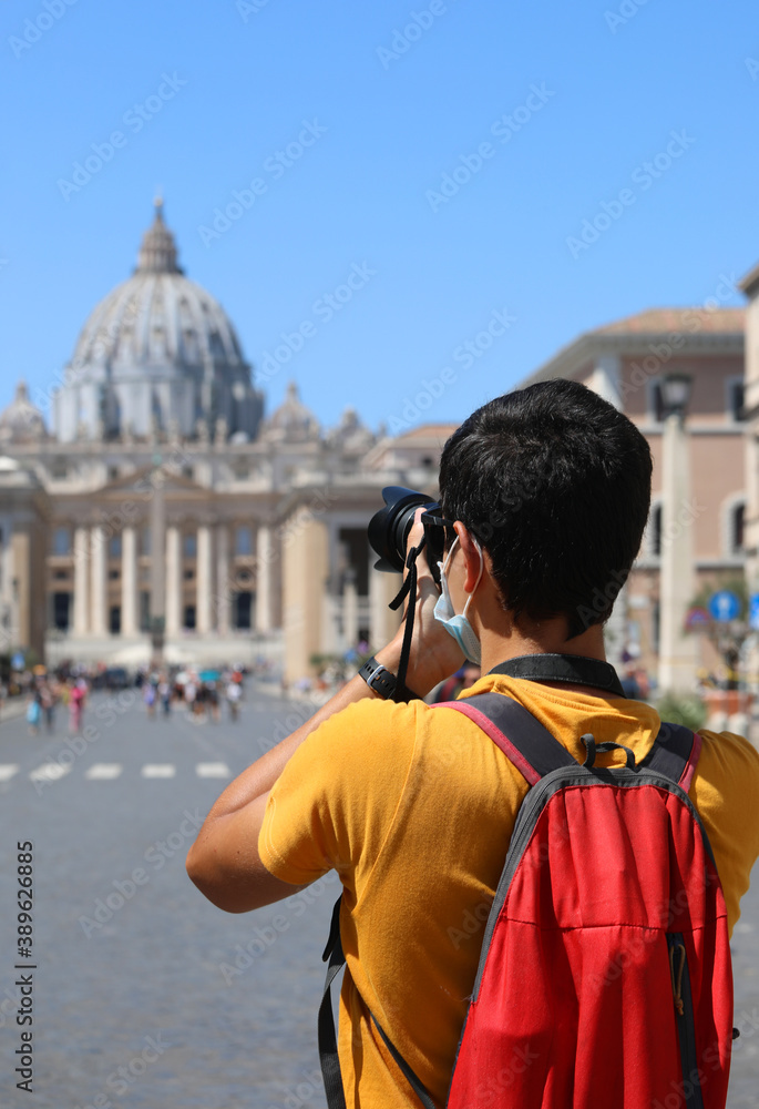 young photographer while traveling around Italy with a backpack