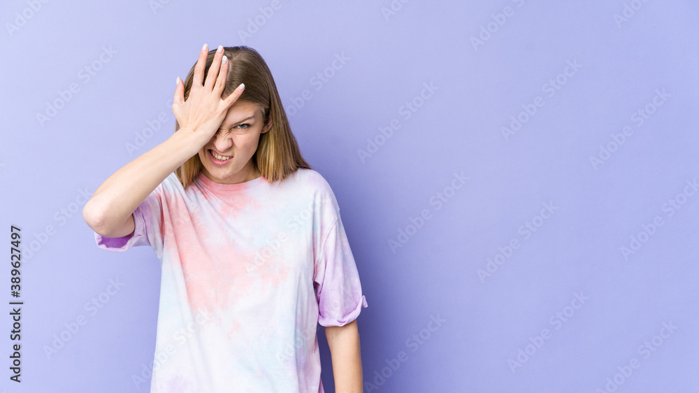 Young blonde woman isolated on purple background forgetting something, slapping forehead with palm and closing eyes. Young blonde woman isolated on purple background forgetting something, slapping forehead with palm and closing eyes.