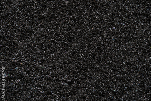 Close up of black absorbing sponge, acoustic foam detail.