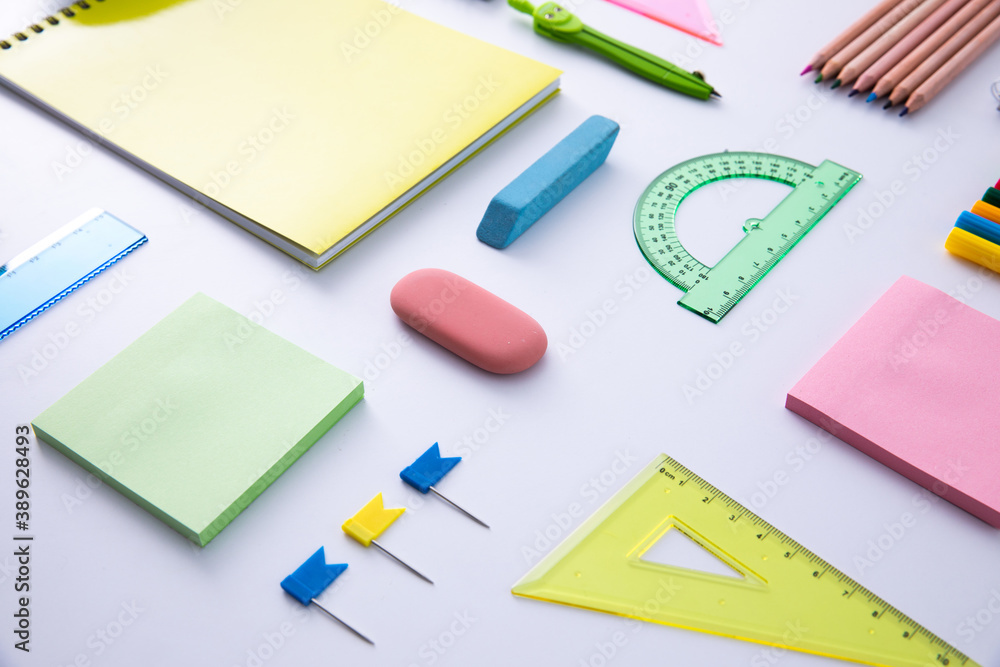 collection of bright colorful stationery on light background, close view . High quality photo collection of bright colorful stationery on light background, close view . High quality photo