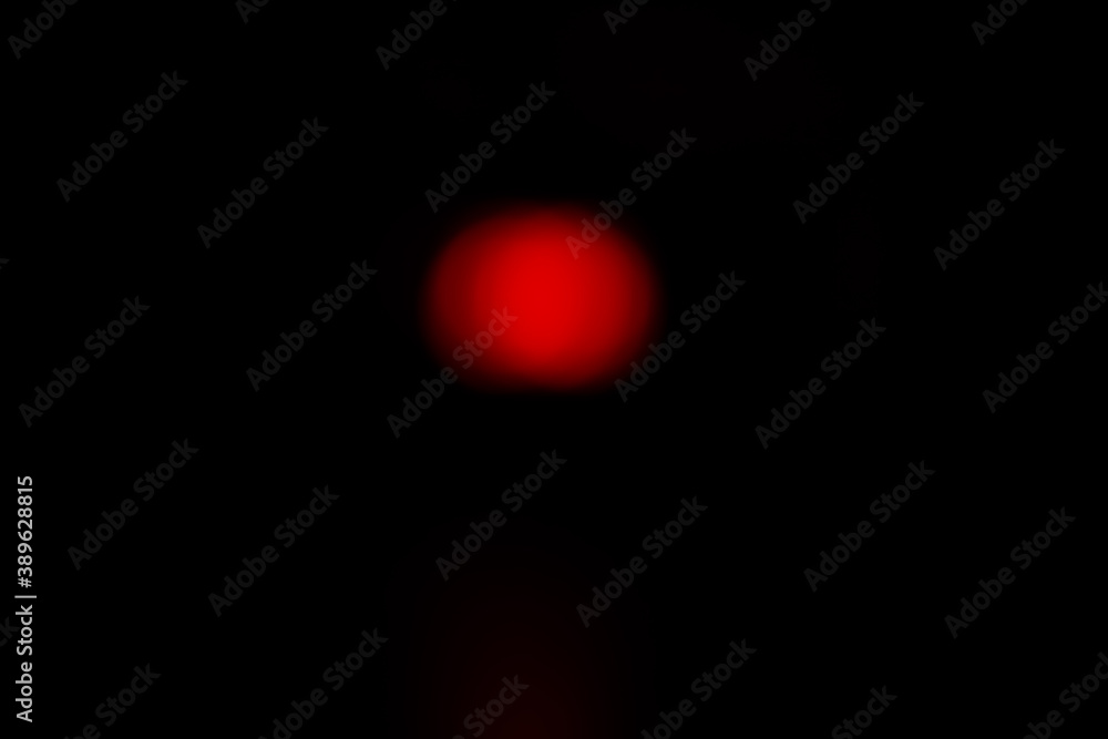 Red bokeh on a dark background. Red bokeh on a dark background.
