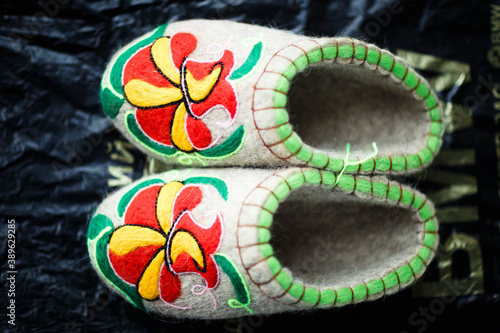 Slippers made of wool,embroidered by the method of felting