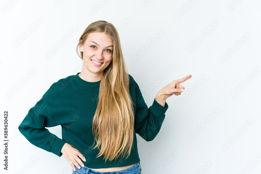 Young blonde woman isolated on white background smiling cheerfully pointing with forefinger away. Young blonde woman isolated on white background smiling cheerfully pointing with forefinger away.