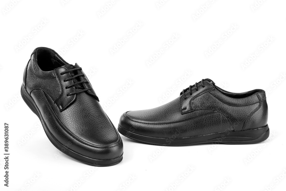 A pair of classic black men's shoes on a white background A pair of classic black men's shoes on a white background