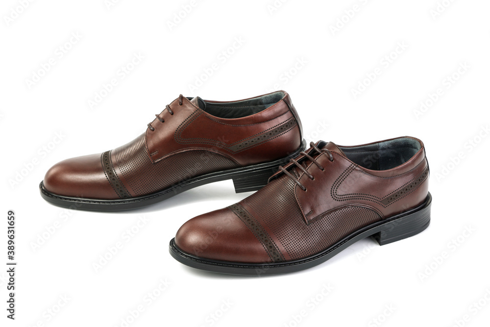 Classic brown leather shoes on a white background Classic brown leather shoes on a white background
