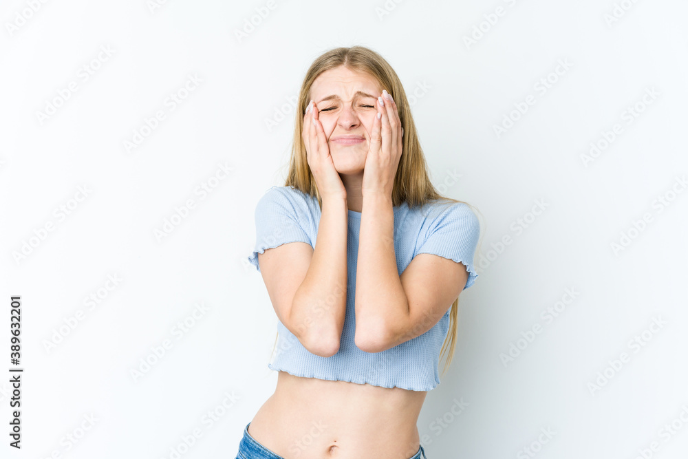 Fototapeta premium Young blonde woman isolated on white background whining and crying disconsolately.